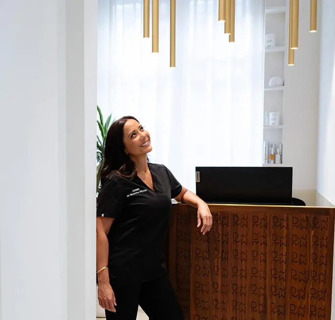 Dr Manrina Rhode in the reception of DRMR Clinic, Knightsbridge
